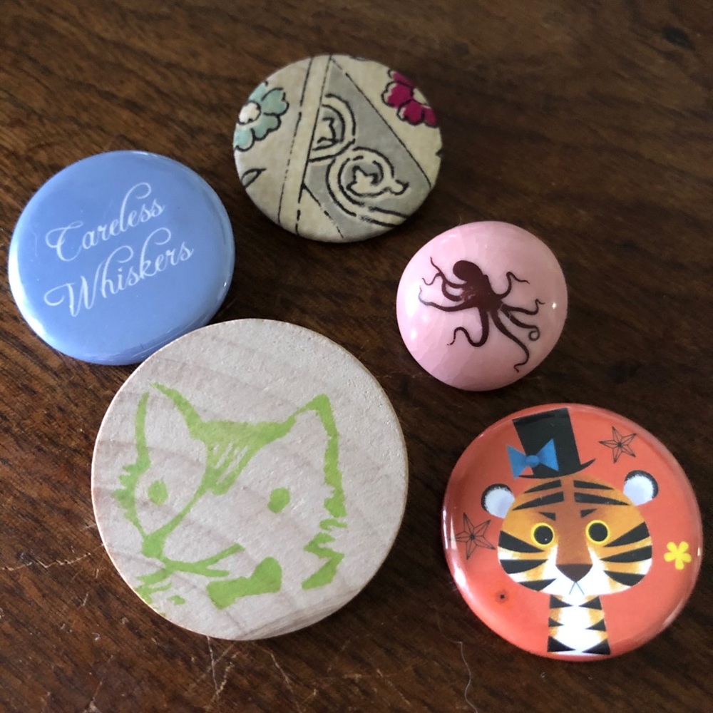 Mix of badge style pins